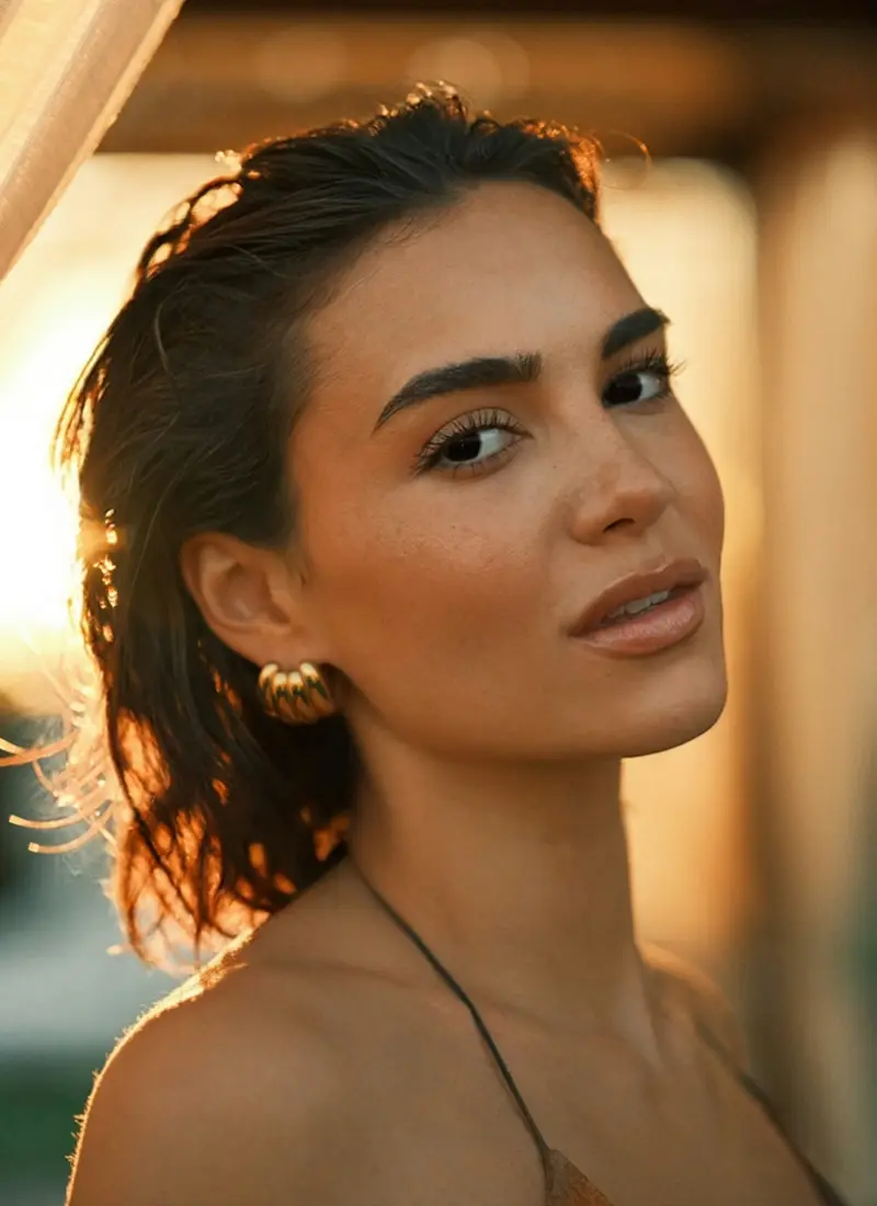 A woman's face at sunset